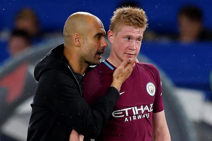 Jose Guardiola Kevin De Bruyne | Kevin de Bruyne je kandidat za Uefinega nogometaša leta, njegov trener pri Manchester Cityju Pep Guardiola pa je kandidat za Uefinega trenerja leta. | Foto Reuters