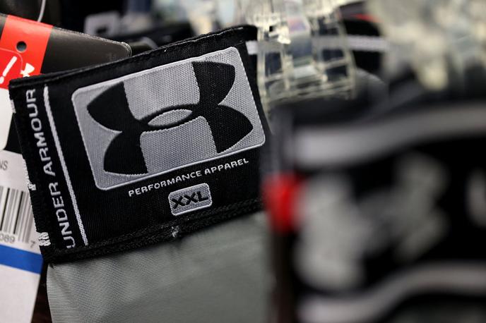 Under Armour | Under Armour je v razmeroma kratkem času postal ena najbolj uveljavljenih znamk športne opreme na svetu in danes velja za člana med kupci zelo priljubljene štiriperesne deteljice, ki jo ob UA tvorijo še Adidas, Nike in Puma. | Foto Reuters