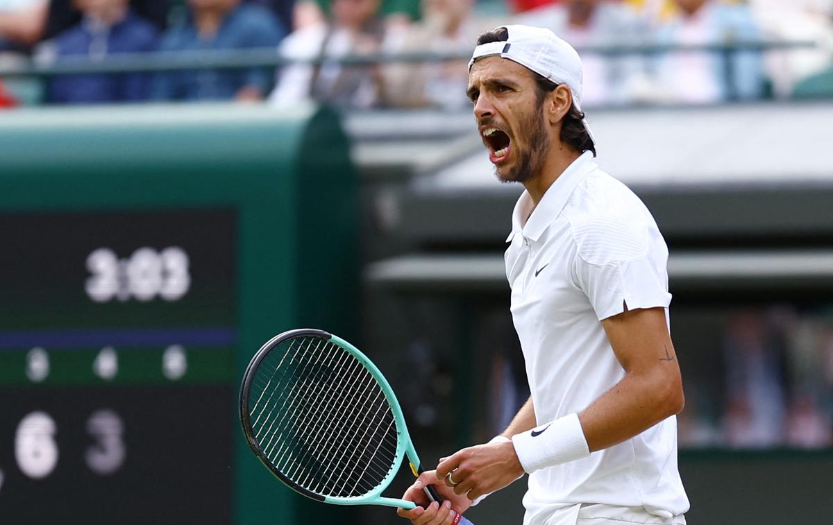 Lorenzo Musetti | Italijan Lorenzo Musetti je zadnji polfinalist teniškega turnirja za grand slam v Wimbledonu. V petek se bo v polfinalu meril z Novakom Đokovićem. | Foto Reuters