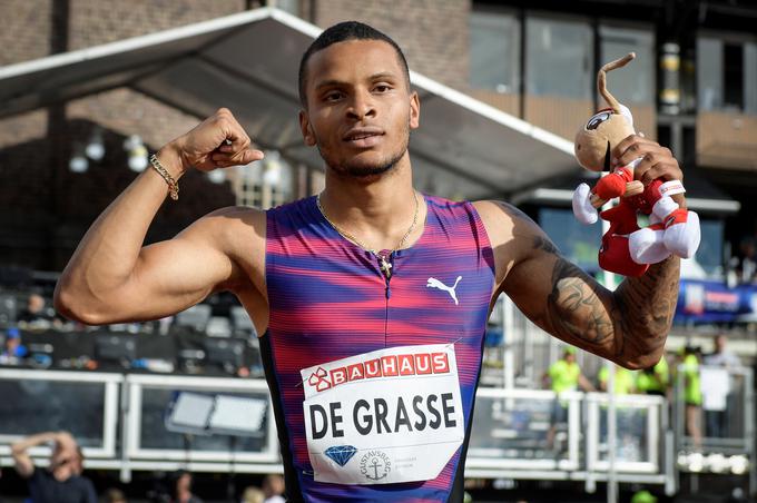 Andre de Grasse je bil izjemno vesel svojega dosežka, čeprav je bil dosežen v premočnem vetru. | Foto: Reuters