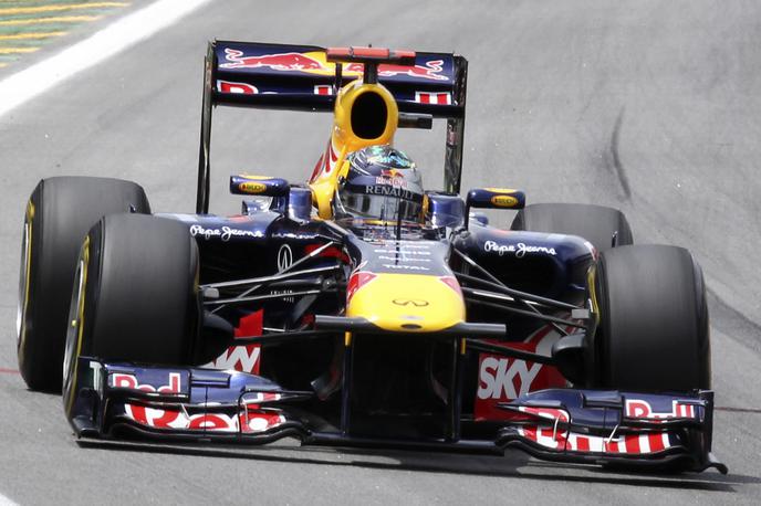 Sebastien Vettel F1 RedBull | Sebastien Vettel je z dirkalnikom RB7 leta 2011 ubranil naslov svetovnega prvaka formule ena. | Foto Reuters