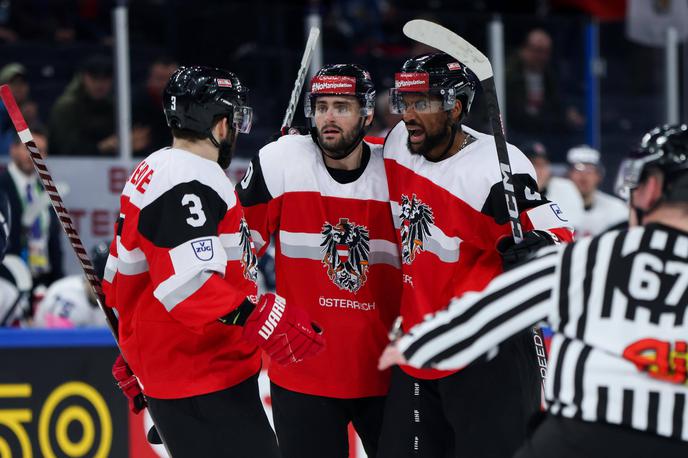 Avstrija SP v hokeju | Avstrijci so po izjemni zadnji tretjini, dobili so jo s kar 5:1, premagali Veliko Britanijo in obstali med elito. | Foto Reuters