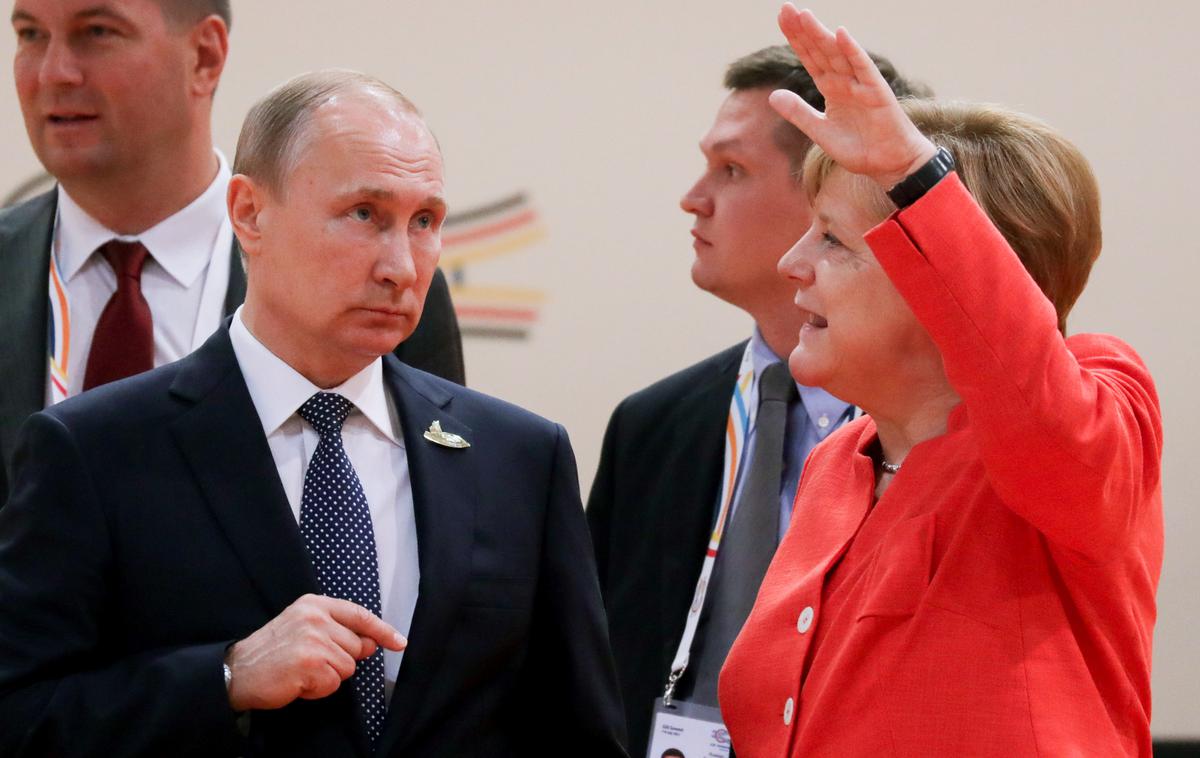 Vladimir Putin in Angela Merkel | Foto Reuters