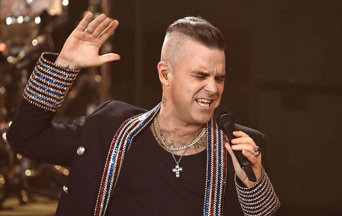 Robbie Williams | Robbie Williams je zaslovel kot član fantovske skupine Take That, leta 1995 pa je odšel na samostojno glasbeno pot. | Foto Guliverimage/AP