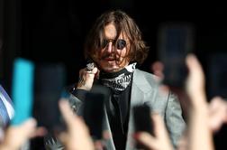 Johnny Depp izgubil bitko proti tabloidu, ki ga je označil za "pretepača žene"