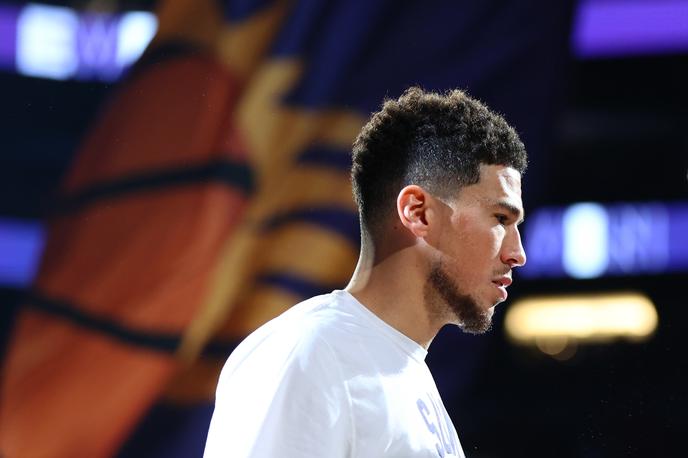 Devin Booker | Košarkarsko moštvo Phoenix Suns se bo moralo še najmanj dve tekmi znajti brez Devina Bookerja.  | Foto Reuters