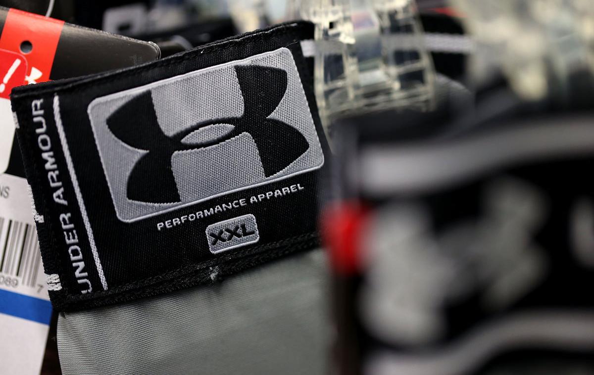 Under Armour | Under Armour je v razmeroma kratkem času postal ena najbolj uveljavljenih znamk športne opreme na svetu in danes velja za člana med kupci zelo priljubljene štiriperesne deteljice, ki jo ob UA tvorijo še Adidas, Nike in Puma. | Foto Reuters