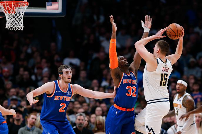 Nikola Jokić | Srb Nikola Jokić se je ob zmagi Denverja izkazal s trojnim dvojčkom. | Foto Reuters