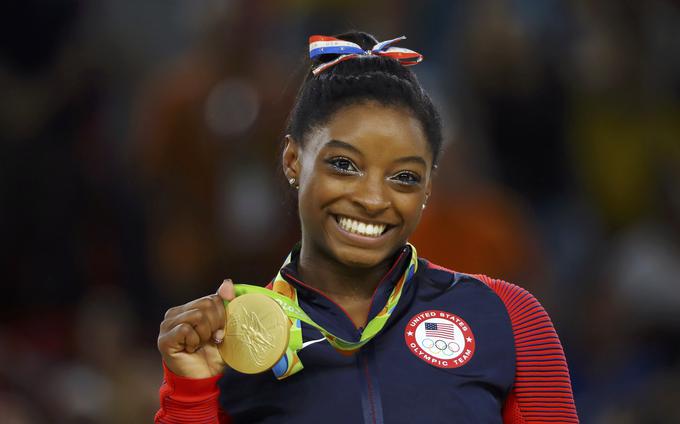 Med športniki, ki jim je dovoljena terapevska izjema, je tudi zlata deklica orodne gimnastike Simone Biles, ki uživa zdravila za hiperaktivnost in motnjo pozornosti. | Foto: Reuters