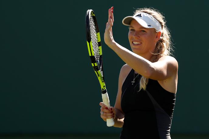 Caroline Wozniacki | Caroline Wozniacki je po vrnitvi na teniška igrišča prejela posebni povabili za nastop na odprtem prvenstvu ZDA ter največjem kanadskem turnirju na trdi podlagi, ki bo letos v Montrealu. | Foto Reuters