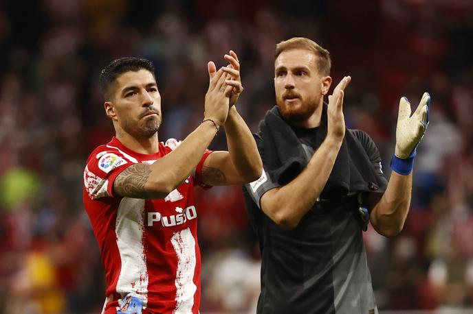 Jan Oblak Luis Suarez | Jan Oblak se je z Atleticom veselil zmage nad Cadizom, prejel je le en gol, ki si ga je v 86. minuti zabil kar sam. | Foto Reuters