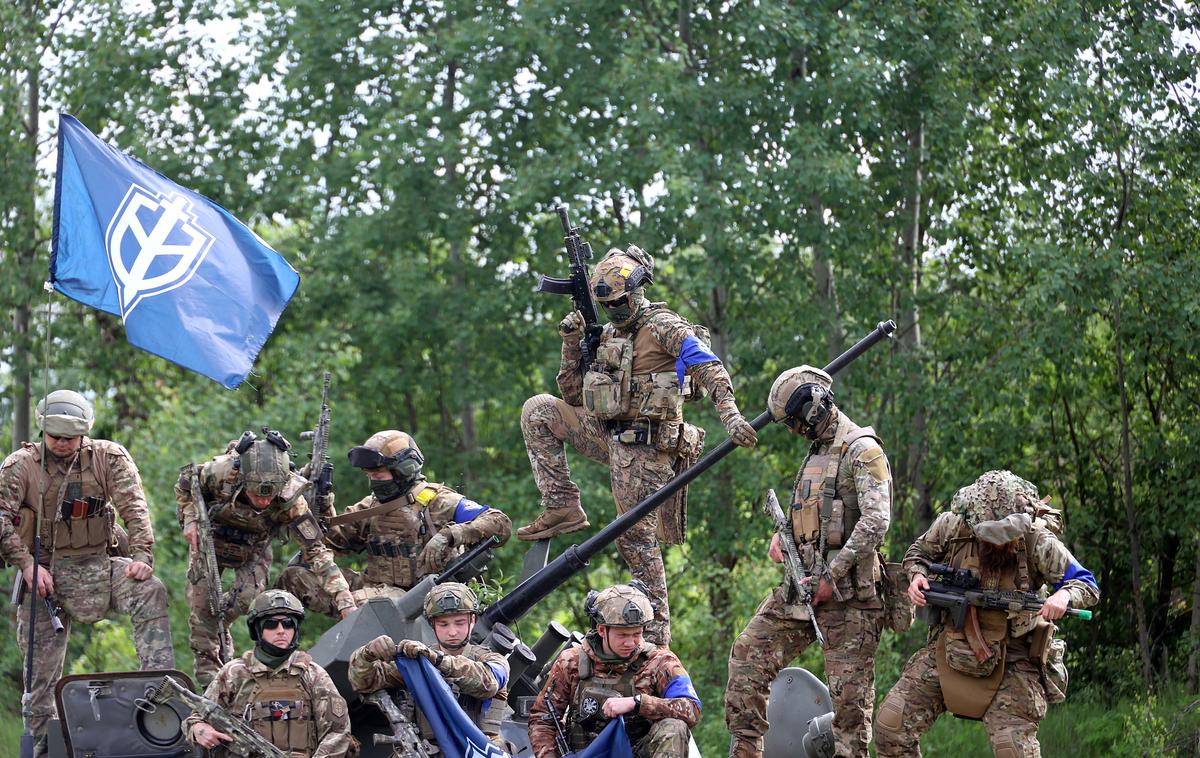 Ruski prostovoljni korpus maja 2023 | Fotografija pripadnikov Ruskega prostovoljnega korpusa (RDK) iz maja lani. Pripadniki RDK sodelujejo tudi pri letošnjem vdoru v ruski regiji Belgorod in Kursk.  | Foto Reuters